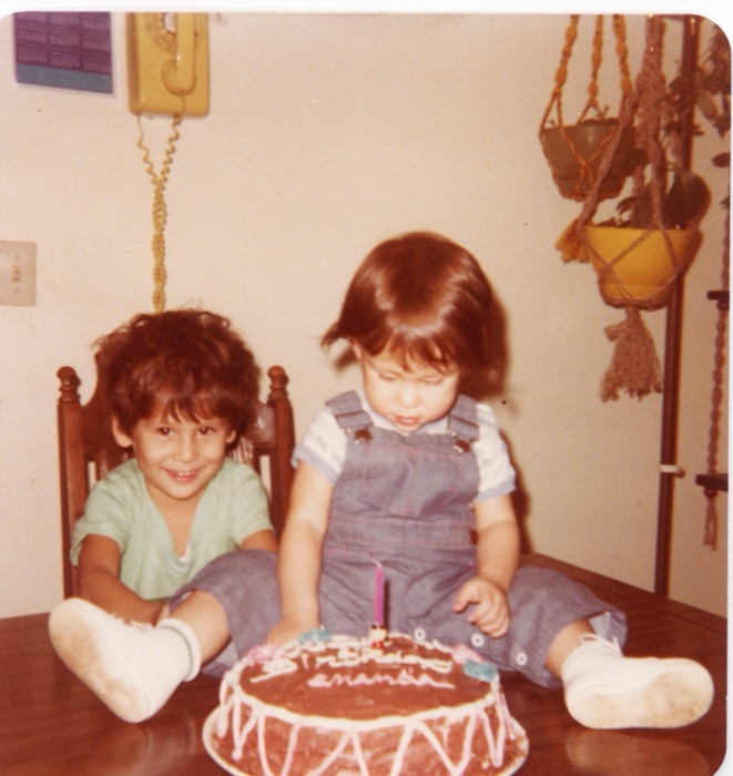 Amanda as a small child, with a birthday cake.